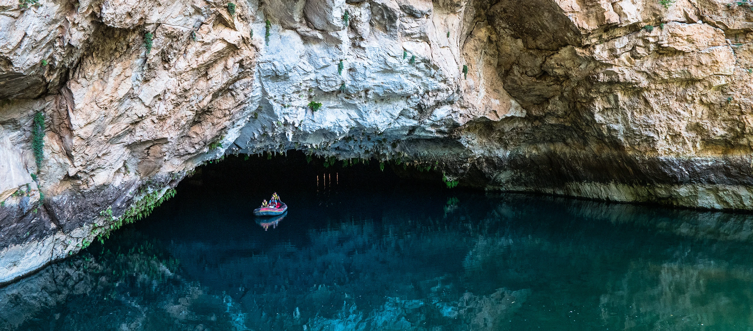 Turquoise underground lake inside Altinbesik Dudensuyu Cave in Antalya