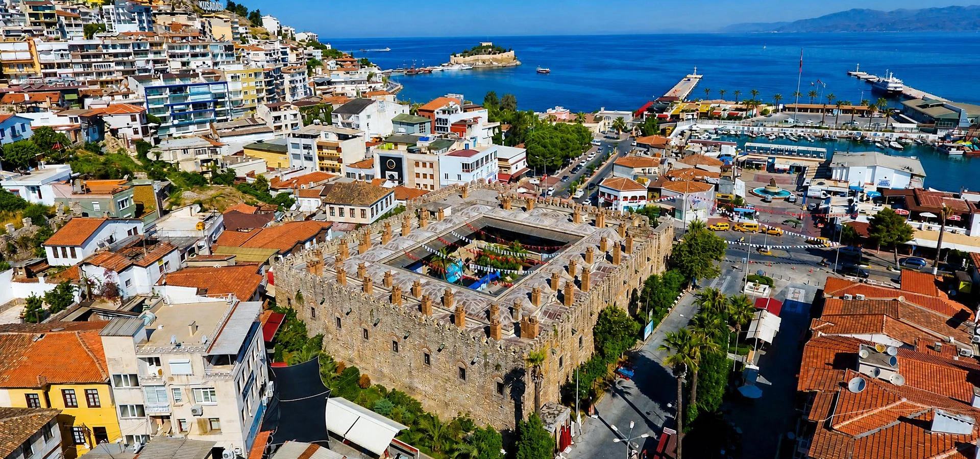 Historic Öküz Mehmet Paşa Caravanserai with fortress-like stone walls in Kuşadası Aydın